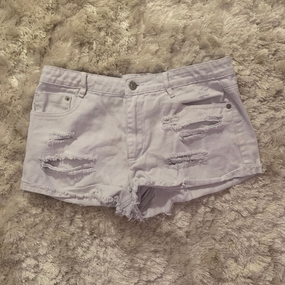 White ripped jean shorts